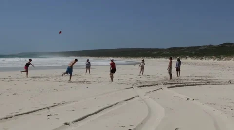 Group of friends playing ball on beach Stock Footage 61643356