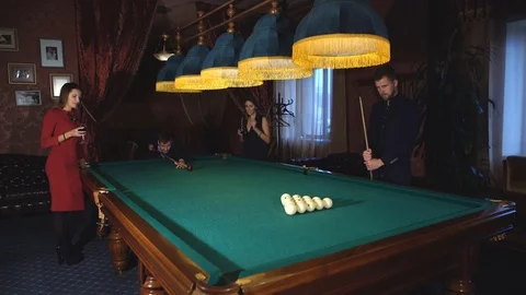 A group of friends playing Billiards Stock Footage 70396633