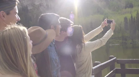 Group Of Friends Pose For Selfies At A Mountain Lake (Slow Motion) Stock Footage 51855688