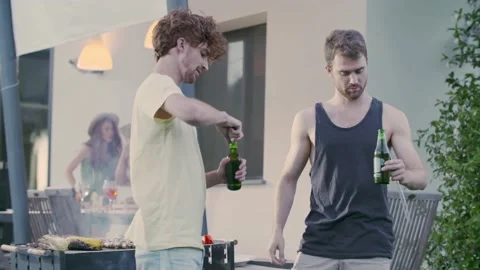 Group of friends preparing meat bbq. Men cheering with beer drink.Double couple Vídeo Stock 155725774