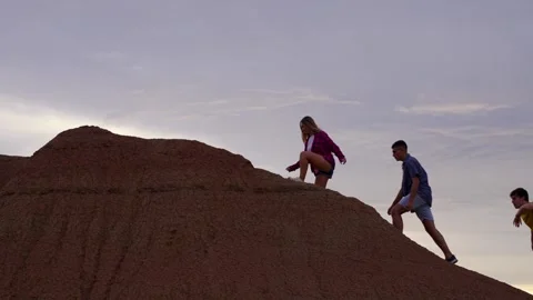Group of friends reaching the top of mountain Stock Footage 250986705