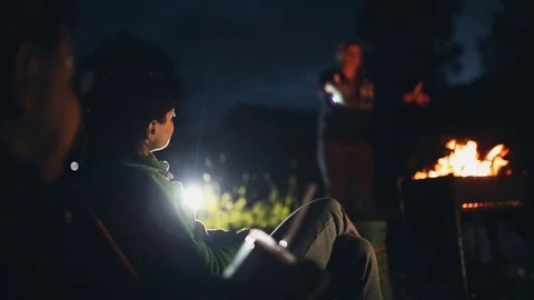 Group of friends sit in a forest Stock Footage 78035532