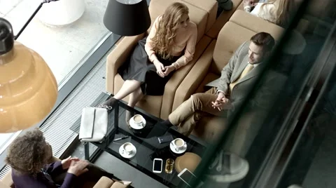 Group of friends sitting at a cafe. Stock Footage 61157602