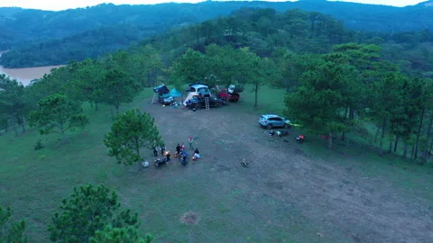 Group of friends sitting outside enjoying, relaxing in the twilight Video stock 158213629