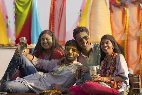 A group of friends sitting  while drinking bhang on holi Stock Photos