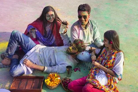 A group of friends sitting  while drinking bhang on holi Stock Photos