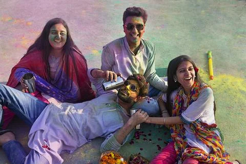 A group of friends sitting  while drinking bhang on holi Stock Photos
