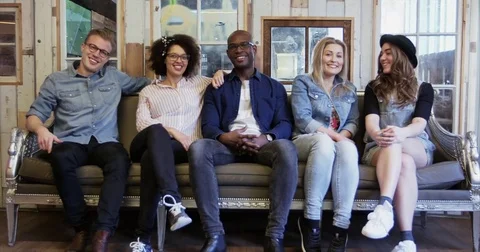 Group of friends sittting in sofa Stock Footage 72696114