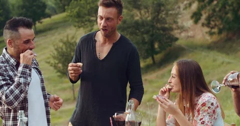 Group of friends spending time making a picnic and a barbeque. shot in slow moti Stock Footage 92470274