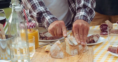 Group of friends spending time making a picnic and a barbeque. shot in slow moti Stock Footage 92470824