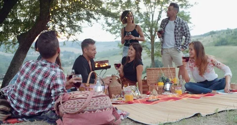 Group of friends spending time making a picnic and a barbeque. shot in slow moti Stock Footage 93071364