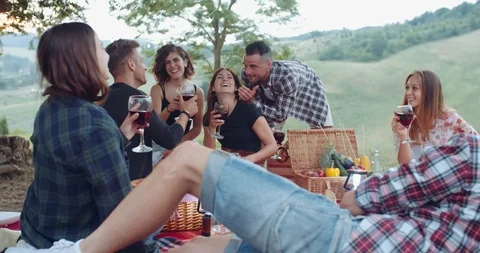 Group of friends spending time making a picnic and a barbeque. shot in slow moti Stock Footage 93072437