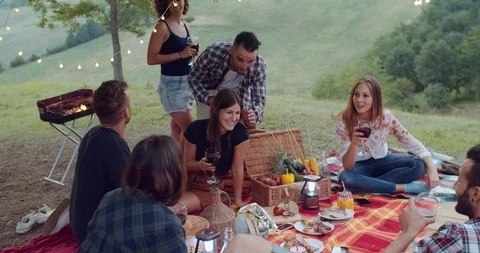 Group of friends spending time making a picnic and a barbeque. shot in slow moti Stock Footage 93072503