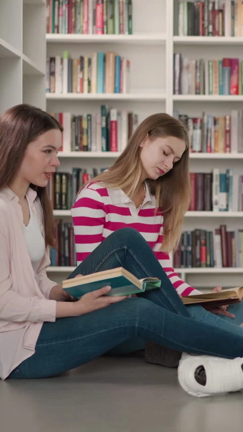 Group of friends study materials in library Stock Footage 281097052