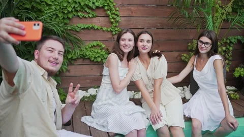 A group of friends take selfies by the s... | Stock Video | Pond5