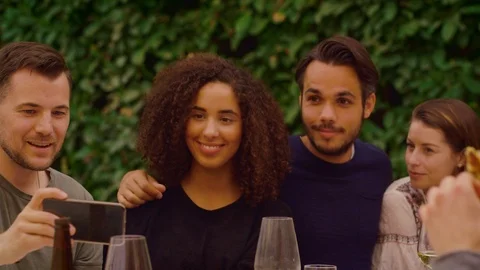 Group of friends taking a selfie on a dinner party Stock Footage 95320407