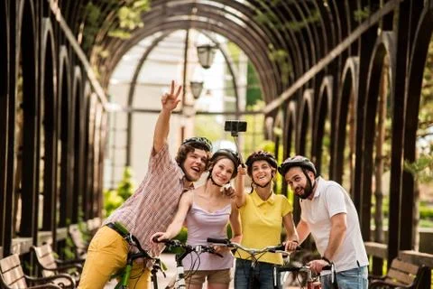Group of friends taking selfie using monopod. Stock Photos