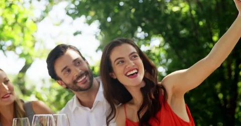 Group of friends taking selfie while having lunch Video stock 72905953