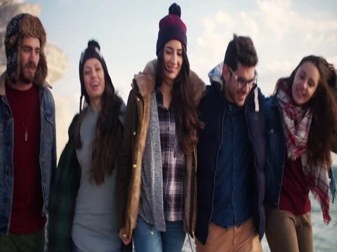 Group of friends together on the beach Stock Footage