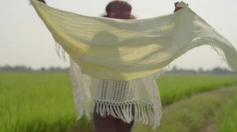 Group of friends walks through rice field Stock Footage 63076404