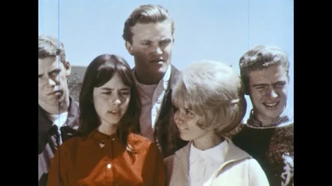 A group of friends watch a shell game. Stock Footage 74698995