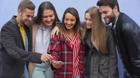 Group of friends watching smart mobile phone Stock Footage 137440707