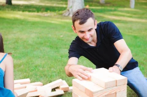 Group game of physical skill with big blocks Foto stock