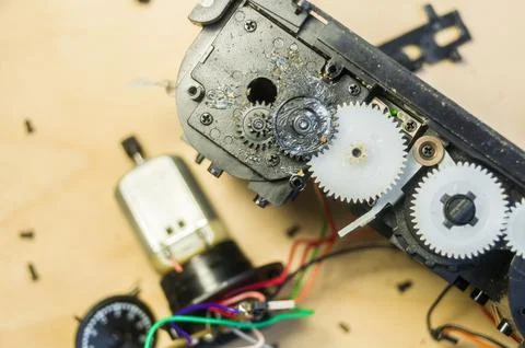 A group of gears of a compact camera to be repaired. Cleaning the gears inside Stock Photos