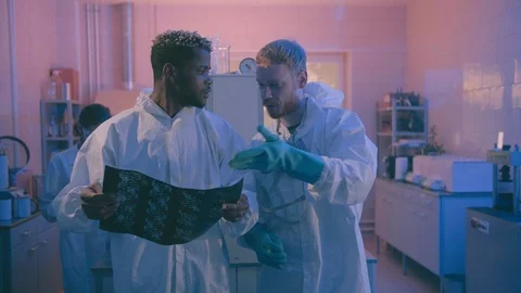 Group of geneticists working with x-ray image of dna molecule in modern Stock Footage 124306098