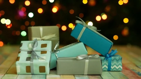 A group of gifts on the background of multi-colored garland lights Vídeos de archivo 122688894