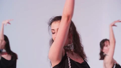 A group of girls are dancing in the studio in black dresses. Stock Footage 153198542
