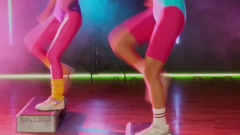 Group of Girls in Leotards Practicing Knee Lifts at Retro Step Aerobics Class Stock Footage 328367518