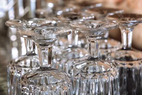 Group of glasses standing upside down. Stock Photos