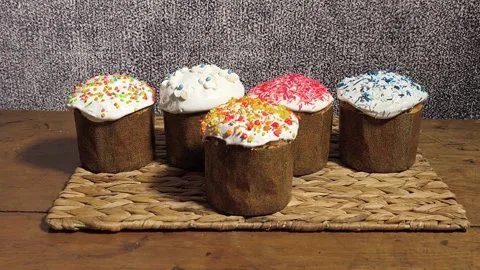 Group of glazed Easter cake treats arranged on rustic surface. Stock Footage 338246426