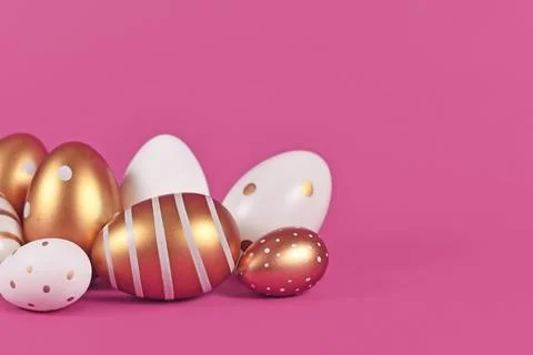 Group of golden and white Easter eggs painted with simple dots and stripes on Stock Photos