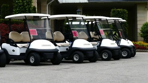 Group of golf cars in front of Aglalrov estate golf club. Stock Footage