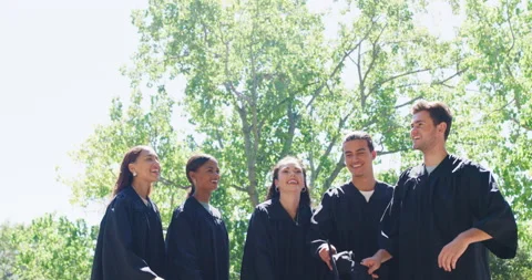 Group of graduates celebrating and throwing caps or hats into the air in Stock Footage 200798686