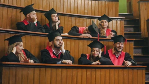 A group of graduating students dressed in mantles have fun, fool around and Stock Footage 245255039