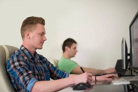 A group of graphic designers at work a group of young graphic designers wo... Stock Photos