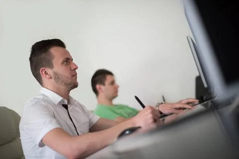 A group of graphic designers at work a group of young graphic designers wo... Stock Photos