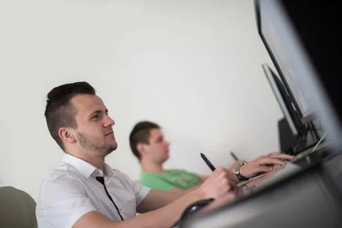 A group of graphic designers at work a group of young graphic designers wo... Stock Photos