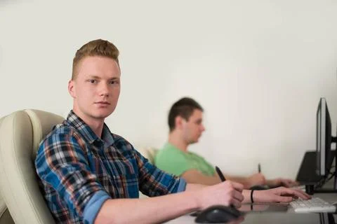 A group of graphic designers at work a group of young graphic designers wo... Stock Photos