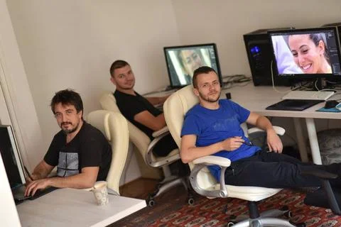A group of graphic designers at work a group of young graphic designers wo... Stock Photos