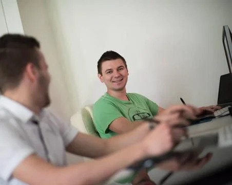 A group of graphic designers at work a group of young graphic designers wo... Stock Photos