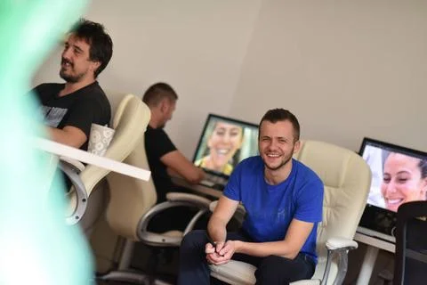 A group of graphic designers at work a group of young graphic designers wo... Stock Photos