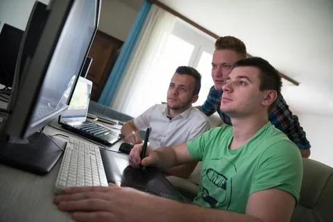 A group of graphic designers at work a group of young graphic designers wo... Stock Photos