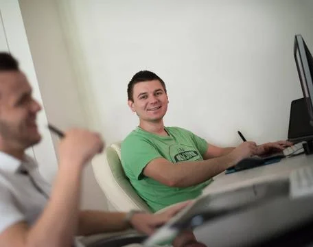 A group of graphic designers at work a group of young graphic designers wo... Stock Photos