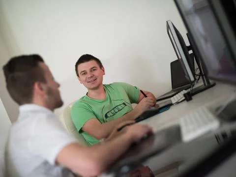 A group of graphic designers at work a group of young graphic designers wo... Stock Photos