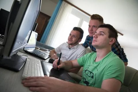 A group of graphic designers at work a group of young graphic designers wo... Stock Photos