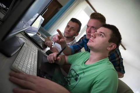 A group of graphic designers at work a group of young graphic designers wo... Stock Photos
